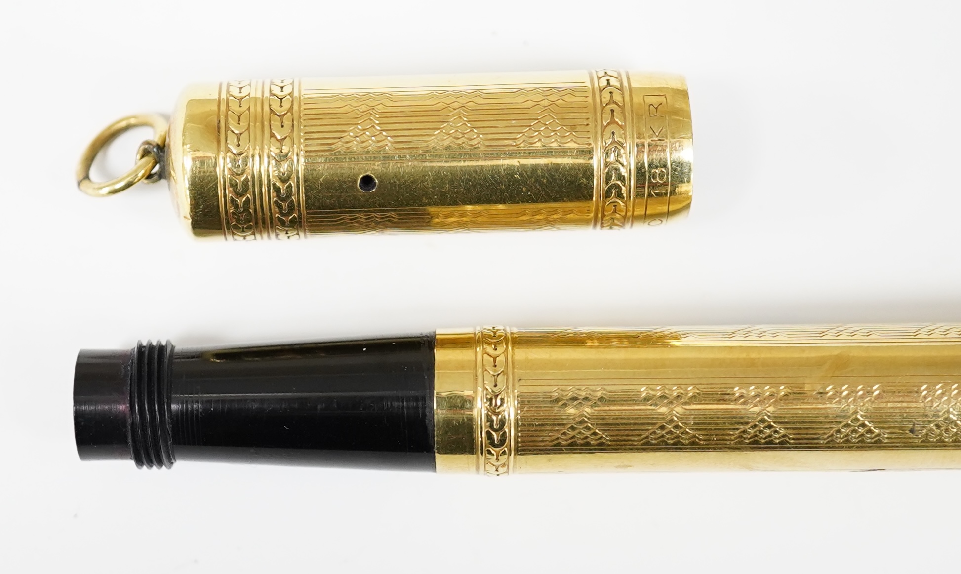 An Elmo rolled gold safety pen fitted with Elmo 14ct. No.4 nib